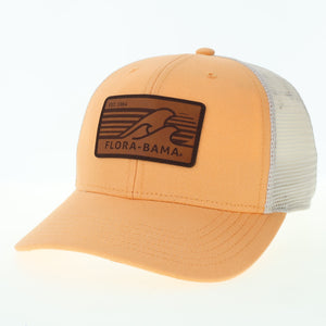 orange hat with  brown patch on the front with brown waves and flora bama text with white mesh backing