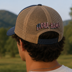 view of back of woven hat with red white and blue flora bama logo