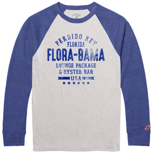 A long sleeve baseball t-shirt with blue sleeves and a cream color torso. The shirt has text 'FLORA-BAMA' printed on it.