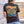 Person wearing shirt with palm trees, geo pattern and person riding a bull with flora bama logo