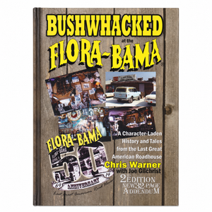 Book cover of 'Bushwhacked at the Flora-Bama' with wooden texture and yellow text.