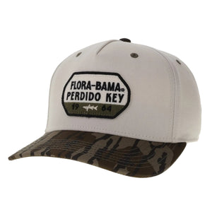 cream hat with camo bill and patch on the front with white and green flora bama black text