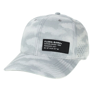 A white and gray camouflage Flora-Bama cap with black patch on lower front left corner.