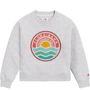 A gray Flora-Bama ladies boxy crewneck sweatshirt with a graphic design featuring the name 'Flora-Bama' and a sun and water circle logo.