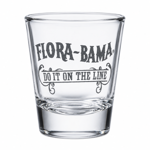 Clear shot glass with 'Flora-Bama' logo