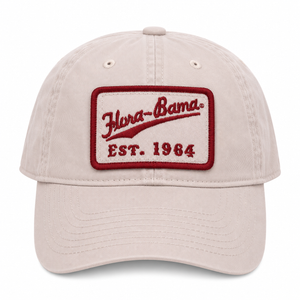 beige cap with red patch on front and flora bama script
