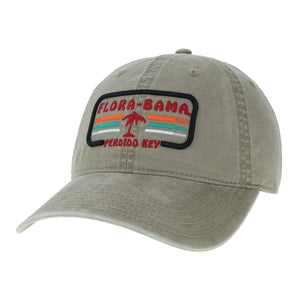 A gray Flora-Bama cap with a curved visor and a patch on the front featuring the Flora-Bama text in red with a palm tree and colored lines