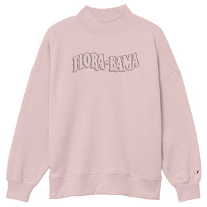 Pink sweatshirt with 'Flora-Bama' text on a white background