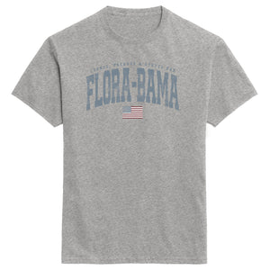 Gray t-shirt with 'Flora-Bama' text and American flag on a white background