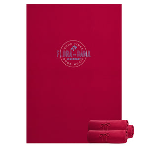 Red blanket with 'Flora Bama' logo on a white background