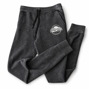 Dark gray sweatpants with a logo on a white background