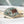 Camouflage cap with leather patch on a boat with ropes