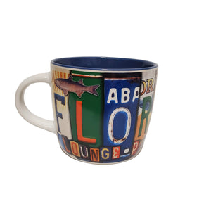 coffee mug with flora bama spelled out on license plates