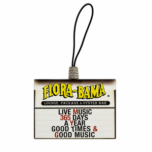 Flora-Bama lounge keychain with text about live music and good times on a white background