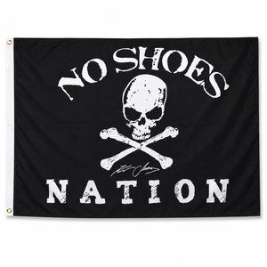 Flag with 'No Shoes Nation' text and skull design on a black background