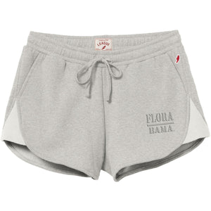 Light heather gray athletic shorts with a drawstring waist, side pockets, and 'FLORA DANA.' text printed on the lower right leg, shown against a plain white background.