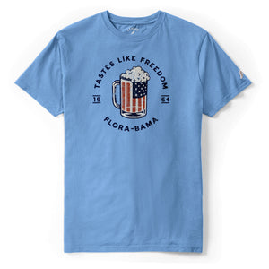 blue short sleeve shirt with red white and blue beer mug and flora bama text in a circle around mug