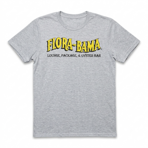 Gray t-shirt with yellow and black text 'Flora-Bama' on a white background