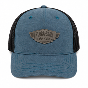 Blue trucker cap with black mesh and Flora-Bama logo on a winged leather patch gray
