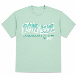 Light green t-shirt with 'Flora-Bama' text on a white background