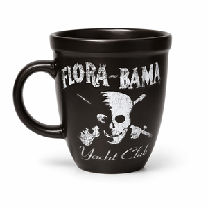 Black mug with 'Flora-Bama Yacht Club' branding and skull design on a white background
