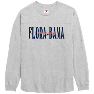 A heather gray long-sleeve t-shirt with 'FLORA-BAMA' printed across the chest in navy blue, with 'central bay' in red script underneath.