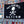 Flag with 'No Shoes Nation' design on a background of license plates.