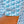 Close-up of a person wearing a patterned shirt with 'Flora-Bama' branding.