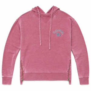 A pink acid-wash hooded sweatshirt with drawstrings, zippered side pockets, and a blue and white 'Skateboard 1964' graphic on the left chest, shown against a plain white background.
