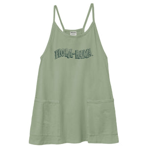 A sage green sleeveless camisole dress with thin shoulder straps, a distressed 'HOLICA BAKAMA' graphic across the chest, and two front patch pockets, shown against a plain white background.
