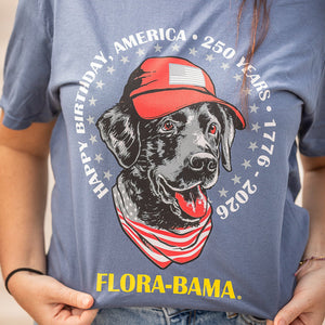 T-shirt with a dog graphic and 'Flora-Bama' text, celebrating America's 250th birthday.