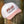 white cap with pink bill and pink embroidered flora bama logo on front