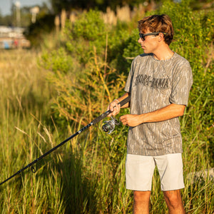 T-shirt with 'Flora-Bama' logo on mossy oak bottomland camo print