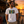man wearing a White t-shirt with a colorful 'Flora-Bama' license plate design on a the front