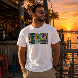 man wearing a White t-shirt with a colorful 'Flora-Bama' license plate design on a the front