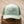 Light blue cap with a green mesh back and logo on a white background