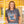 woman wearing Gray t-shirt with an eagle graphic and flora bama text 