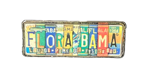 A colorful license plate patch with the text 'FLORA BAMA' prominently displayed.