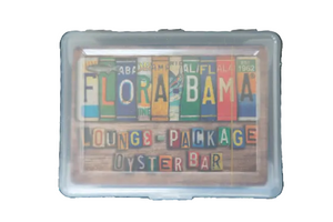 A deck of cards with 'Flora-Bama' text and colorful license plate designs, enclosed in a clear plastic case.